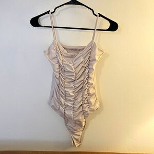 Abercrombie & Fitch cream ruffled body suit. Never worn size small